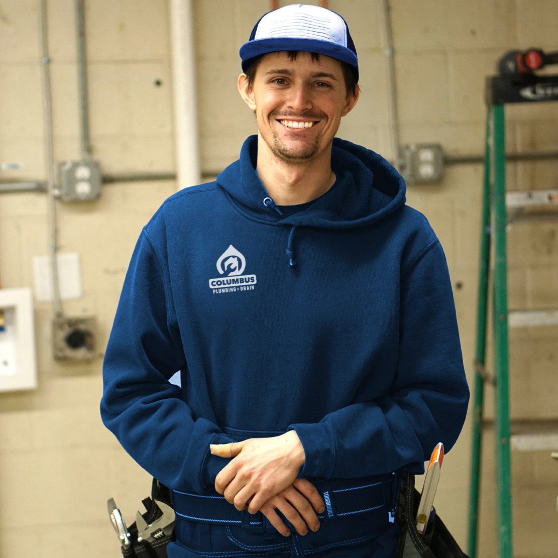 Plumber fixing a toilet